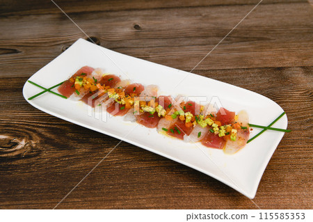 FISH CEVICHE RECIPE, SEA BREAM AND TUNA, AVOCADO, BELL PEPPER, CHILLI, CHIVES, LEMON, OLIVE OIL FISH CEVICHE RECIPE, SEA BREAM AND TUNA, AVOCADO, BELL PEPPER, CHILLI, CHIVES, LEMON, OLIVE OIL 115585353