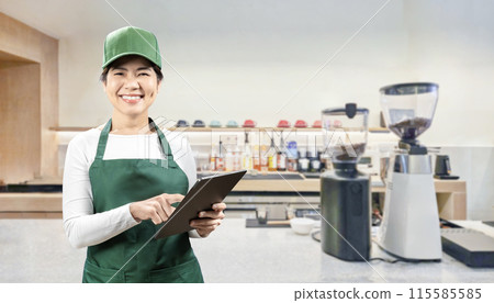 Business owner or seller in cafe or coffee shop Business owner or seller in cafe or coffee shop 115585585