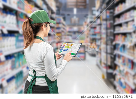 Asian seller wear green apron and cap rear view in retail store Asian seller wear green apron and cap rear view in retail store 115585671