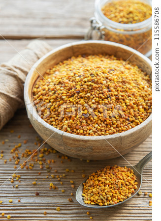 Healthy bee pollen grains. Bee pollen on a bowl. Healthy bee pollen grains. Bee pollen on a bowl. 115586708