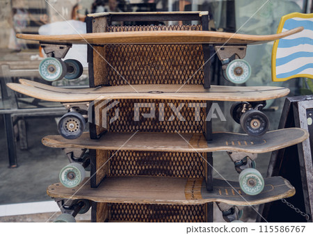 A stack of skateboards on a special outdoor stand A stack of skateboards on a special outdoor stand 115586767
