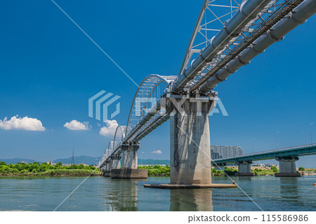 Hirakata Ohashi Bridge and Aqueduct Bridge spanning the Yodo River 115586986