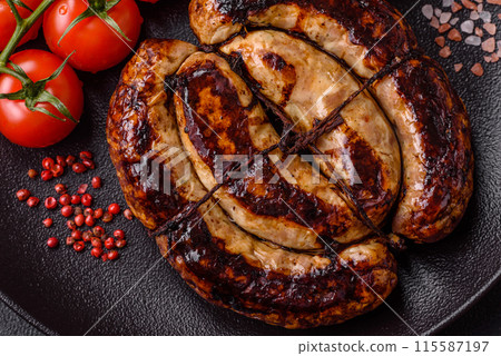 Delicious grilled sausage in the form of a ring with salt, spices 115587197