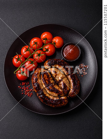 Delicious grilled sausage in the form of a ring with salt, spices Delicious grilled sausage in the form of a ring with salt, spices 115587201