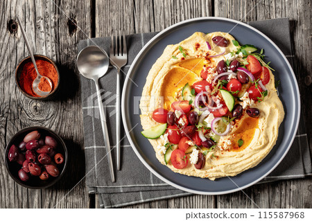 Greek hummus with veggies, olives, feta on plate 115587968