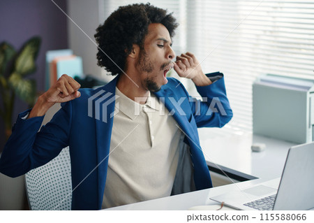 Yawning Bored Businessman Yawning Bored Businessman 115588066