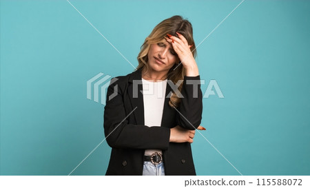 Tired transgender businesswoman suffering from headache 115588072