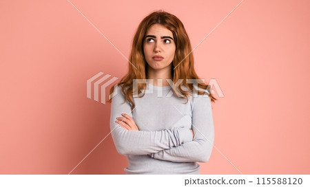 Doubtful woman with thoughtful expression in pink studio Doubtful woman with thoughtful expression in pink studio 115588120