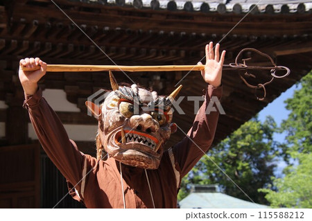 Yellow-faced demon posing with a shakujo Yellow-faced demon posing with a shakujo 115588212