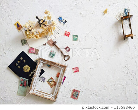 Old stamps and dried flowers and frame 115588460