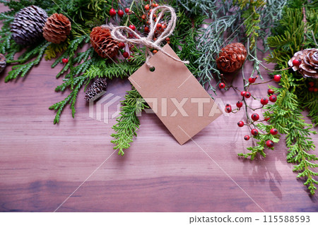 Christmas decorations and blank card on a wooden table 115588593