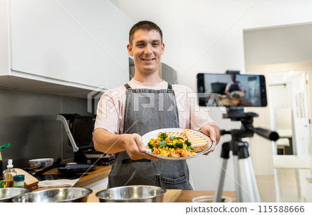 The chef is broadcasting live from workshop how to prepare a vegetarian food 115588666