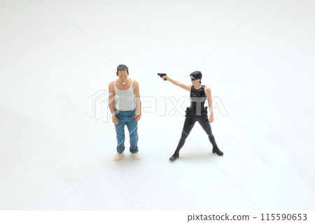 a figure woman with gun pointed, holding gun shooting. a figure woman with gun pointed, holding gun shooting. 115590653