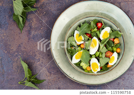 Salad with stinging nettle leaves and egg. Salad with stinging nettle leaves and egg. 115590758