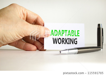 Adaptable working symbol. Concept words Adaptable working on beautiful white paper. Beautiful white background. Businessman hand. Business Adaptable working concept. Copy space. 115591785