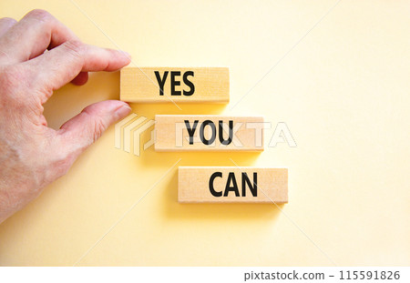 Motivational and Yes you can symbol. Concept words Yes you can on beautiful wooden blocks. Beautiful white background. Businessman hand. Business motivational and Yes you can concept. Copy space. Motivational and Yes you can symbol. Concept words Yes you can on beautiful wooden blocks. Beautiful white background. Businessman hand. Business motivational and Yes you can concept. Copy space. 115591826