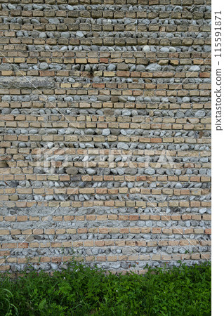 Bricks and stones wall 115591871