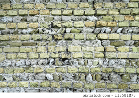 Bricks and stones wall 115591873