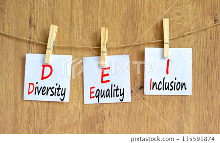 DEI diversity equality inclusion symbol. Concept words DEI diversity equality inclusion on beautiful paper. Beautiful wooden background. Business DEI diversity equality inclusion concept. Copy space. 115591874