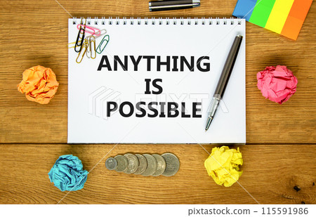 Anything is possible symbol. Concept words Anything is possible on beautiful white note. Beautiful wooden background. Black pen. Colored paper. Business anything possible concept. Copy space. 115591986