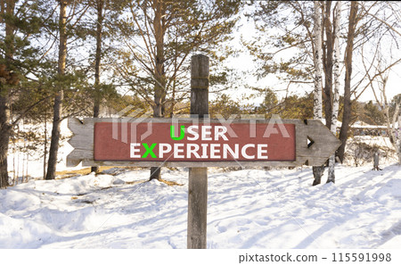 UX user experience symbol. Concept words UX user experience on beautiful wooden road sign. Beautiful forest snow blue sky background. Business and UX user experience concept. Copy space. UX user experience symbol. Concept words UX user experience on beautiful wooden road sign. Beautiful forest snow blue sky background. Business and UX user experience concept. Copy space. 115591998