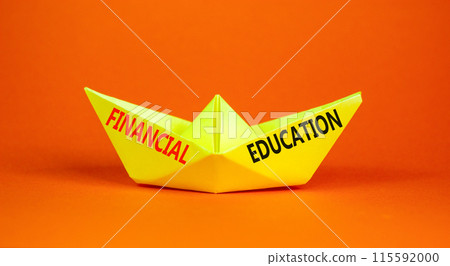 Financial education symbol. Concept words Financial education on beautiful yellow paper boat. Beautiful orange paper background. Business Financial education concept. Copy space. 115592000