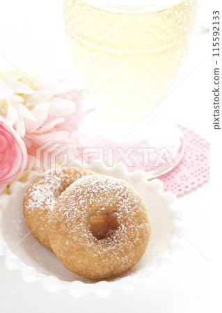 Mini sugar donuts and cold tea Mini sugar donuts and cold tea 115592133