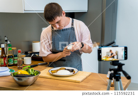 The chef is broadcasting live from workshop how to prepare a grilled eggplants with garlic The chef is broadcasting live from workshop how to prepare a grilled eggplants with garlic 115592231