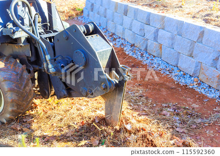 Using trencher cable plow tractor to lay fiber optic cables 115592360