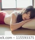 Woman lying on bed 115593375