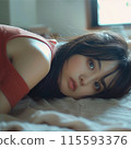 Woman lying on bed 115593376