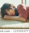 Woman lying on bed 115593377