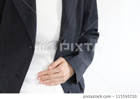 A woman holding her stomach Abdominal pain image 115593720