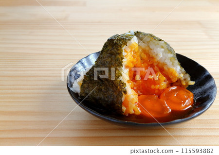 Egg yolk rice ball on table background Egg yolk rice ball on table background 115593882
