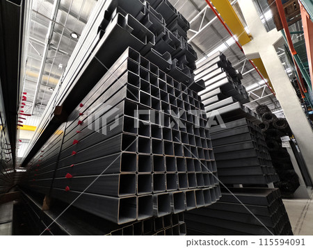 A big warehouse packed with numerous metallic nets and profile A big warehouse packed with numerous metallic nets and profile 115594091