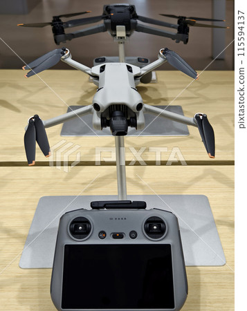 Modern drone for video and photo in the light store Modern drone for video and photo in the light store 115594137