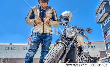 A male rider wearing a separate chest protector 115594894