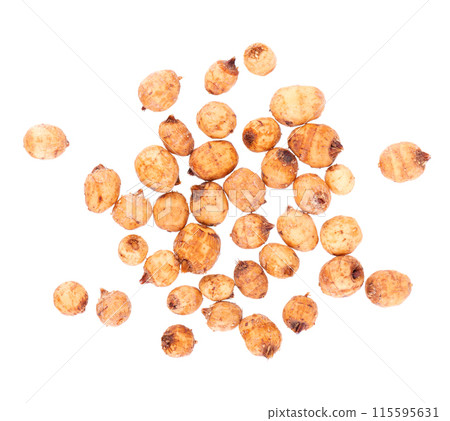 Tiger nuts isolated on white background. Pile of chufa nuts, earth almond or chufa sedge. Cyperus esculentus. Top view. Tiger nuts isolated on white background. Pile of chufa nuts, earth almond or chufa sedge. Cyperus esculentus. Top view. 115595631
