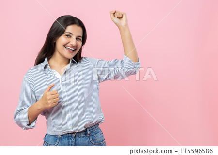 Overjoyed Indian woman dancing happily celebrating success copy space Overjoyed Indian woman dancing happily celebrating success copy space 115596586