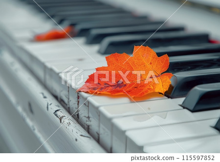 Orange Leaf Resting on White Piano Keys in Autumn Orange Leaf Resting on White Piano Keys in Autumn 115597852