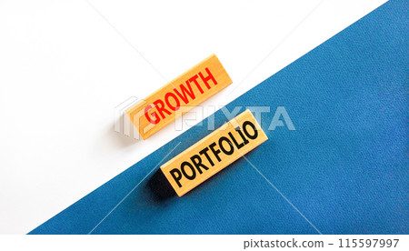 Growth portfolio symbol. Concept words Growth portfolio on beautiful wooden block. Beautiful blue and white paper background. Business Growth portfolio concept. Copy space. 115597997