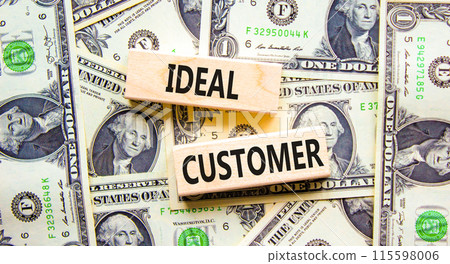 Ideal customer symbol. Concept words Ideal customer on beautiful wooden blocks. Dollar bills. Beautiful background from dollar bills. Business ideal customer concept. Copy space. 115598006