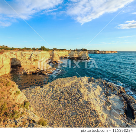 Surise Faraglioni at Torre Sant Andrea, Italy 115598284