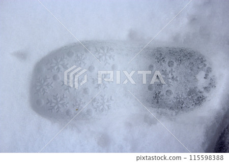 Trace of shoe on a snow during the thaw. Approximation of spring. 115598388