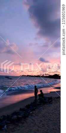 Couple at sunset on the northeast coast of Brazil Couple at sunset on the northeast coast of Brazil 115601969