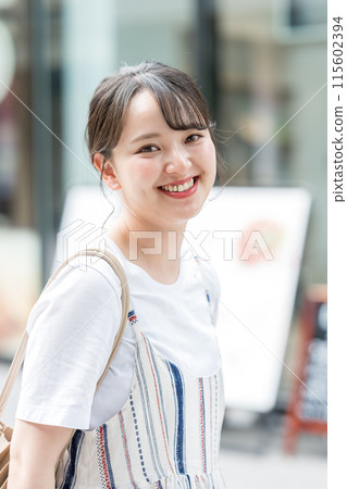 Young and cute Japanese women walking around town for shopping | Shopping image | Street walking image 115602394