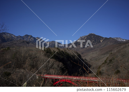 The red Higashizawa Bridge in Hokuto City in late autumn The red Higashizawa Bridge in Hokuto City in late autumn 115602679