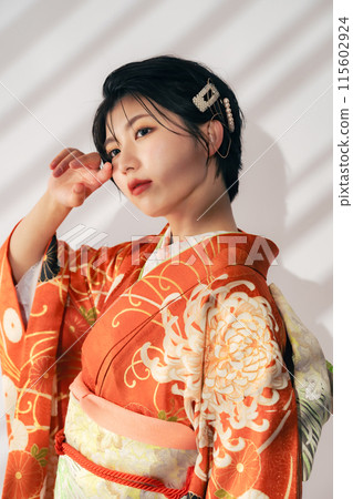 Portrait of a woman wearing a kimono, Coming of Age Ceremony, Dressing Portrait of a woman wearing a kimono, Coming of Age Ceremony, Dressing 115602924
