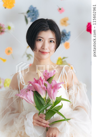 Beauty image of a woman holding flowers Skin care Cosmetics Beauty image of a woman holding flowers Skin care Cosmetics 115602961