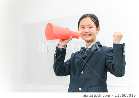 High school and junior high school girls in blazers cheering with megaphones High school and junior high school girls in blazers cheering with megaphones 115603016